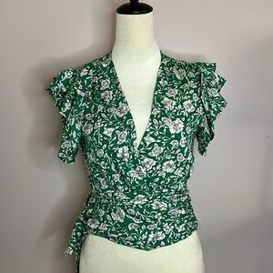 Green and white flutter sleeved wrap around top with waist tie. Size Small.